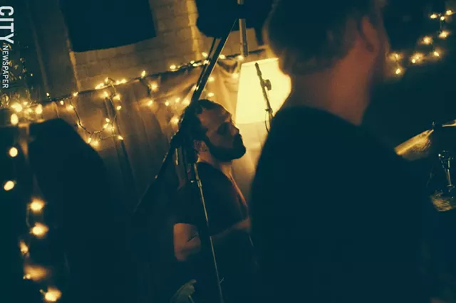 Oh Manitou playing a small show at Wicked Squid Studios. - PHOTO BY KEVIN FULLER