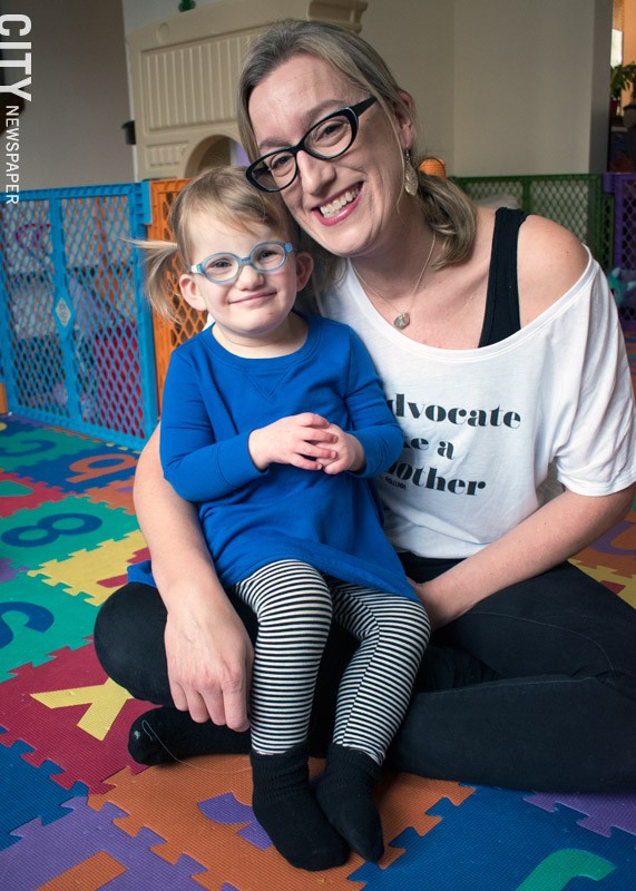 Kim Dooher says that the Early Intervention providers who have worked with her daughter, Vivian, are responsible for much of the 2 ½-year-old's progress and development. - PHOTO BY RENÉE HEININGER