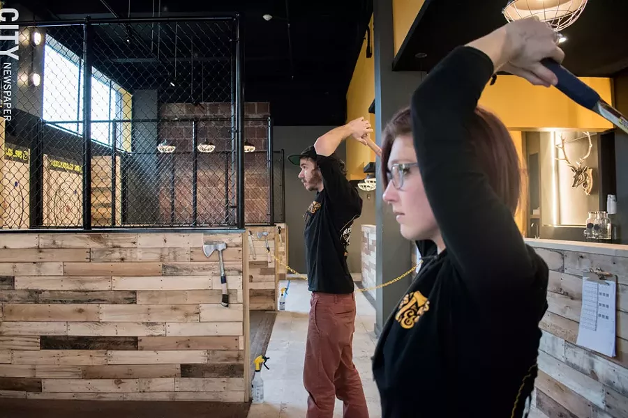 Axes & Ales employees Alyssa and Michael show how it's done. - PHOTO BY JACOB WALSH