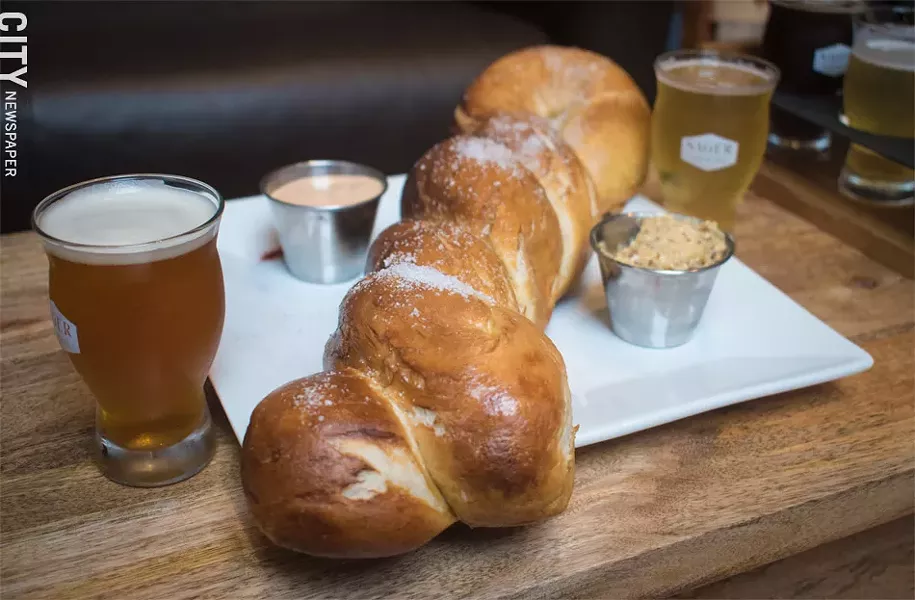 Perfect to pair with any brew: the enormous soft pretzel at Sager Beer Works. - PHOTO BY JACOB WALSH