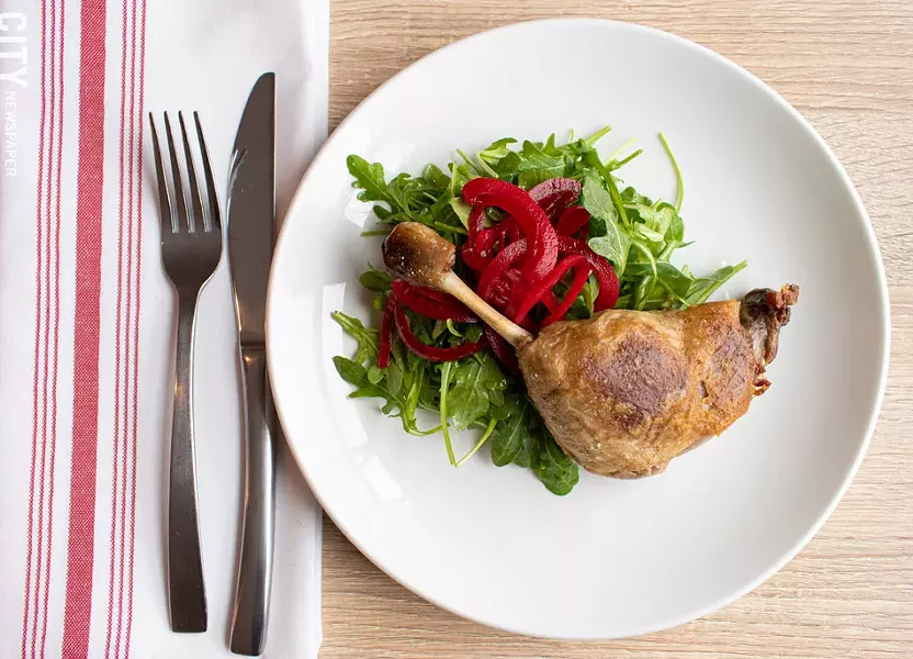 The dark, oily meat of the outrageously rich duck confit seemed to fall off the bone as if by magic. - PHOTO BY JACOB WALSH