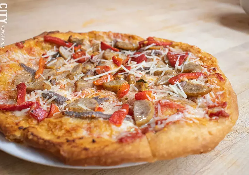 Paulino's specialty, fried pizza. - PHOTO BY JACOB WALSH