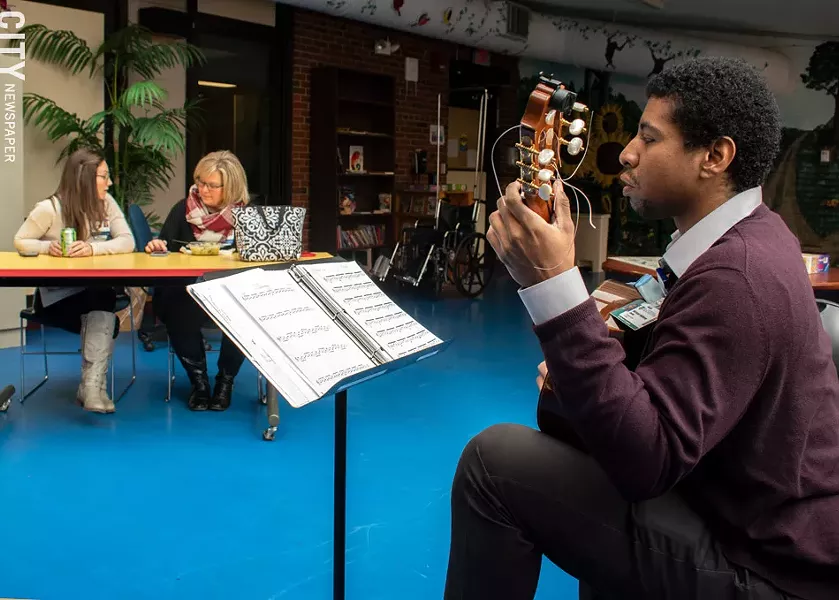 Classical guitarist Michael Anthony Jones performs at Strong Hospital. - PHOTO BY RENÉE HEININGER