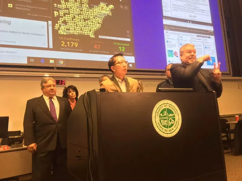 Monroe County Health Commissioner Dr. Michael Mendoza and other local officials briefing reporters on Saturday, March 14. - PHOTO BY BRETT DAHLBERG