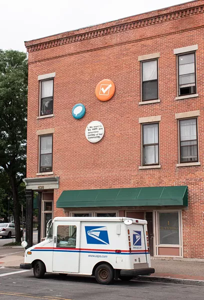 More installed "buttons" from "Underpin & Covercoat" on the side of SewGreen Rochester. - PHOTO BY JACOB WALSH