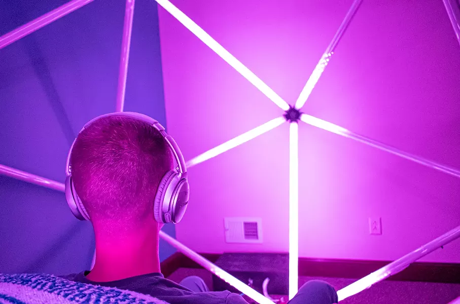 Dr. Aaron Olden sits inside "BLOOM" at MIndful Medicine Rochester. - PHOTO BY JACOB WALSH