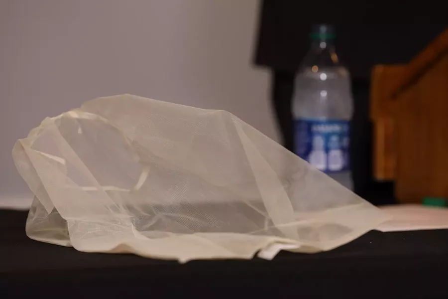 Michael Mazzeo, Rochester police union president, displayed a spit sock for reporters and explained why officers would use it. - PHOTO BY MAX SCHULTE