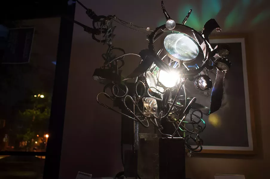 Annalisa Barron's "Place Projectors" in the atrium of Writers & Books. - PHOTO BY JACOB WALSH