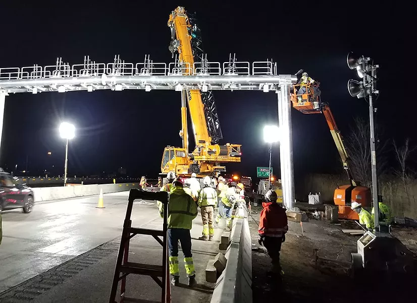 A crew installs a gantry over Thruway lanes in the Syracuse suburb of Manlius. - PHOTO PROVIDED BY NYS THRUWAY AUTHORITY