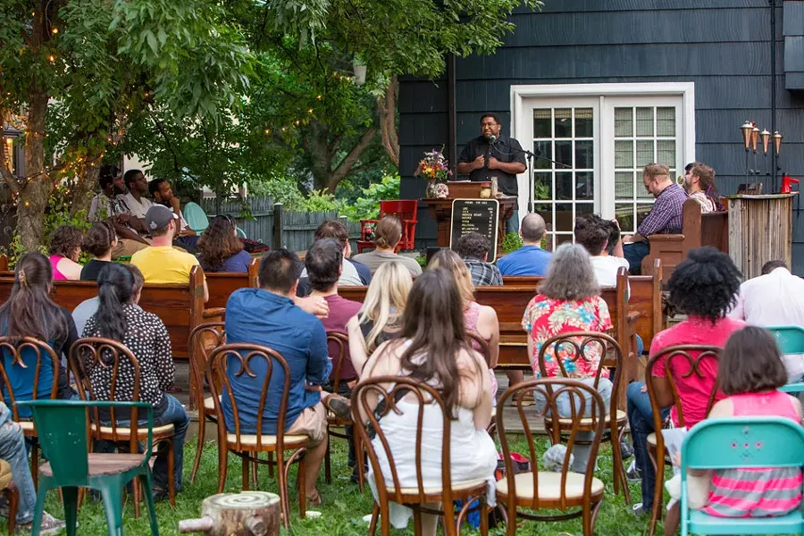 Ohio poet Scott Woods was a featured reader at the July 11 event. - PHOTO BY JOHN SCHLIA