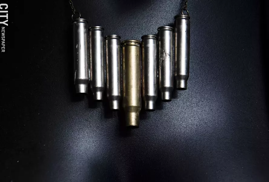 A necklace using bullet casings made by Grimble. - PHOTO BY MARK CHAMBERLIN
