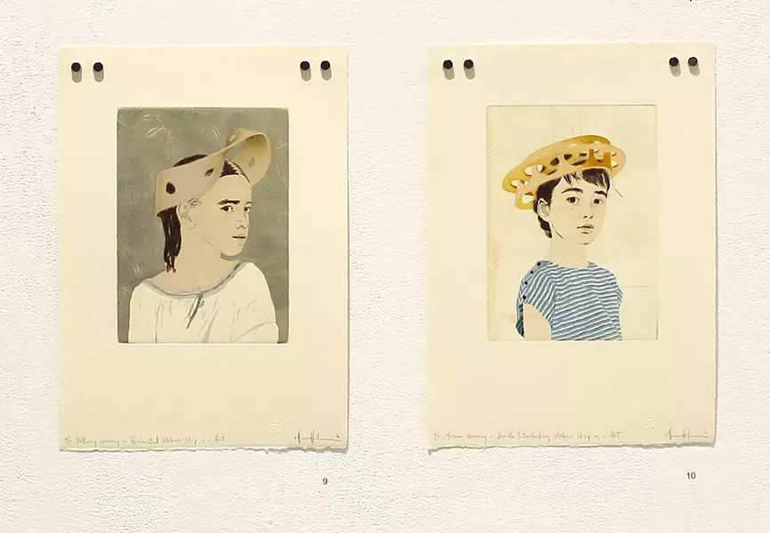 Installation view of Ellen Heck's "Fascinators" series of portraits of young girls with Mobius Strips for hats. - PHOTO PROVIDED