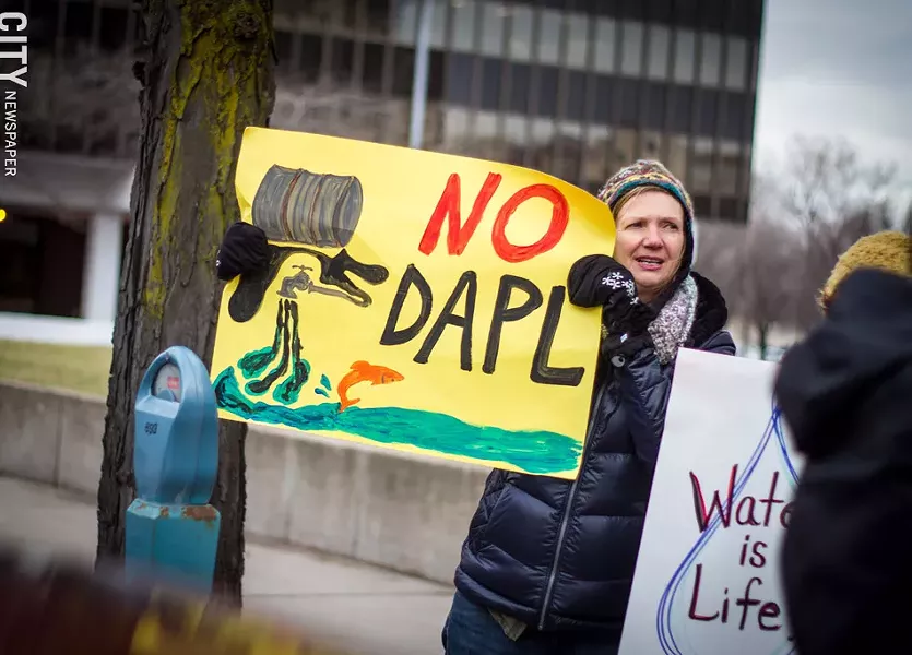Protesters gathered in front of the Federal Building on Friday to demonstrate against President Donald Trump’s executive orders on the Keystone XL and Dakota Access pipelines. - PHOTO BY KEVIN FULLER