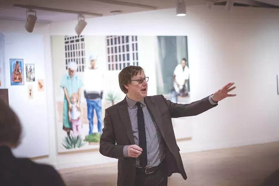 MAG Director Jonathan Binstock at the gallery’s Meleko Mokgosi exhibit. - PHOTO BY KEVIN FULLER