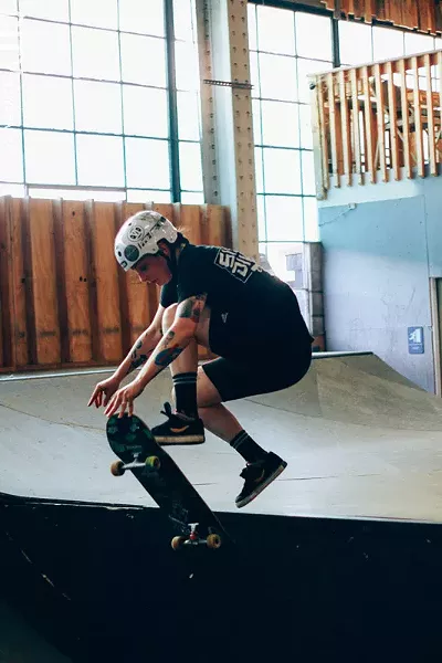 Markham, an experienced skater, jumps off a ledge. - PHOTO BY KEVIN FULLER