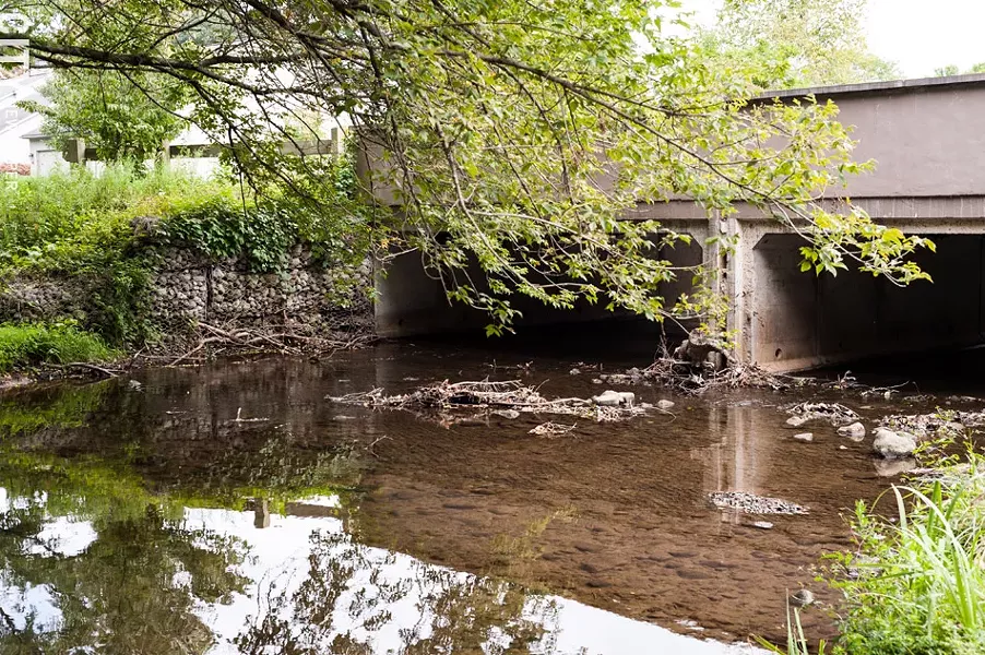 The Town of Penfield plans to carry out some anti-erosion projects along Allen Creek. Some of the work could include armoring stream banks, as has been done in this spot near Winding Creek Lane. - PHOTO BY JEREMY MOULE