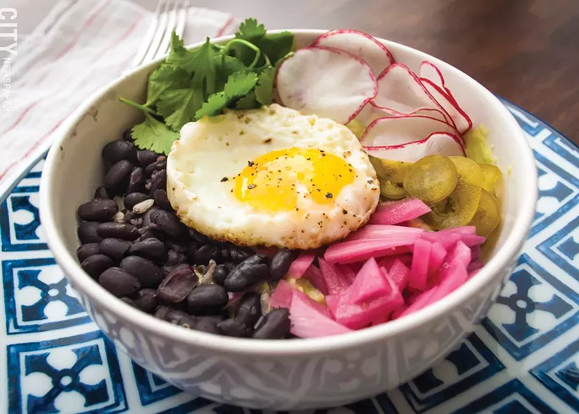 The Disco Bowl, featuring quinoa, brown rice, pickled jalapeños, onion, tortilla strips, radish, and Baja sauce. - PHOTO BY RYAN WILLIAMSON