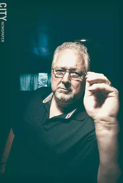 Nick Maguire has been playing darts at Casey Jones on Ridgeway Avenue since 1982. - PHOTO BY RYAN WILLIAMSON
