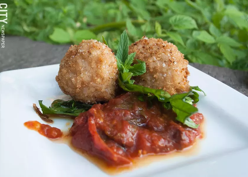 Crispy brown rice arancini stuffed with mozzarella and Gorgonzola. - PHOTO BY RYAN WILLIAMSON