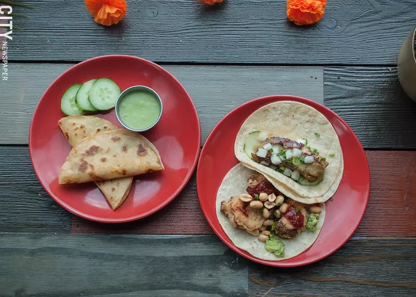 On the menu at Lulu Taqueria, from left: Smoked swordfish tacos are served with a side of salsa verde. The pork belly taco (top right) and cauliflower taco featuring avocado, peanuts, honey roja salsa (bottom right). - PHOTO BY REBECCA RAFFERTY