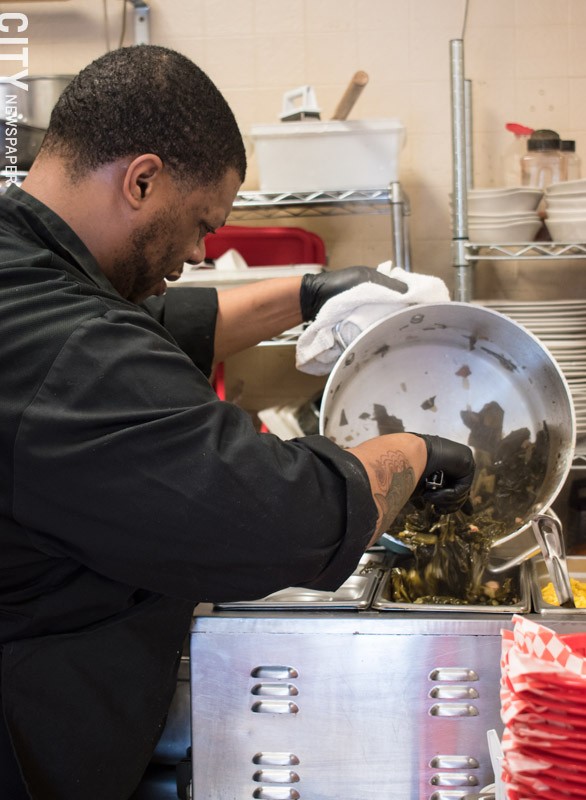 Chick'N Out cook Kevin Stevens prepares collards at Blossom Road Pub. - PHOTO BY JACOB WALSH