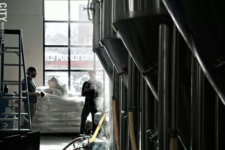 Steam rises from kettles at Three Heads Brewing on Thursday, January 30. The brewery was producing a new batch of The Kind IPA, Three Heads' best-selling beer. - PHOTO BY GINO FANELLI