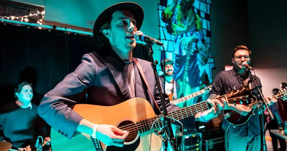 Ray Mahar (forefront) leading A Girl Named Genny at a Three Heads Brewing Gig in 2018. - PHOTO BY AARON WINTERS