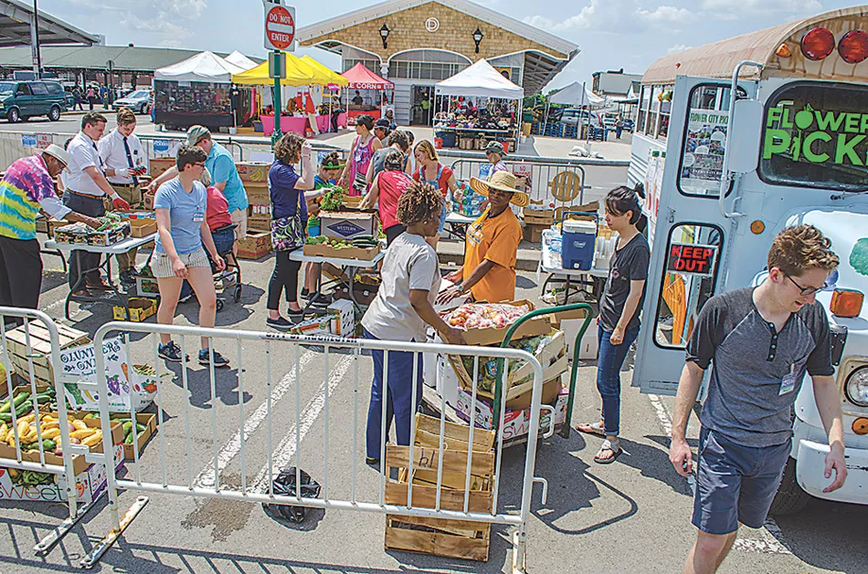 Flower City Pickers volunteers help sort food at the Public Market. - PHOTO COURTESY FLOWER CITY PICKERS