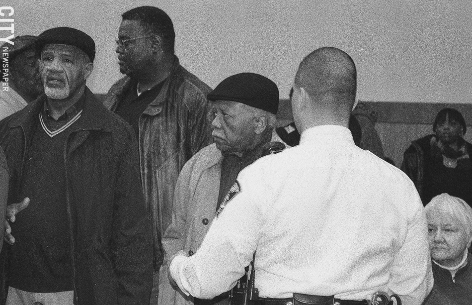 Florence (second from right) and Raymond Scott (left) were arrested during a 2008 protest at the County Office Building. The issue: the County Legislature’s politicization of the public defender selection process. - PHOTO BY JEREMY MOULE