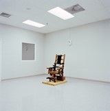 PHOTO COURTESY THE ARTIST AND WEATHERSPOON ART MUSEUM - Lucinda Devlin’s photograph, “Electric Chair, Greensville Correctional Facility, Greensville, VA, 1991,” from the series “The Omega Suites,” is part of a survey of her work currently on view at Eastman Museum.