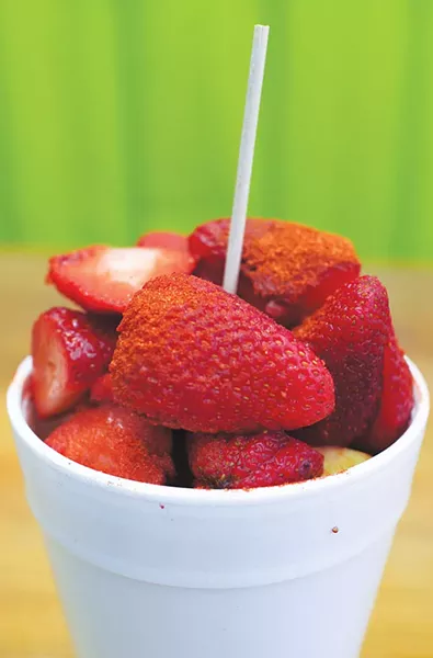 A strawberry-mango fruit cup — powdered with Lucas — from Las Nieves. - WILL LEE