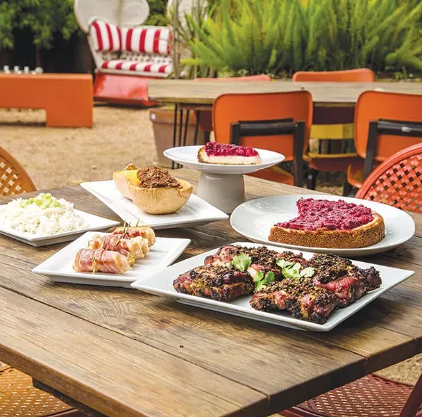 Clockwise: Ginger-cranberry cheesecake, Thai-style marinated rib, apples on piggyback, rice, butternut squash and bacon jam - CASEY HOWELL