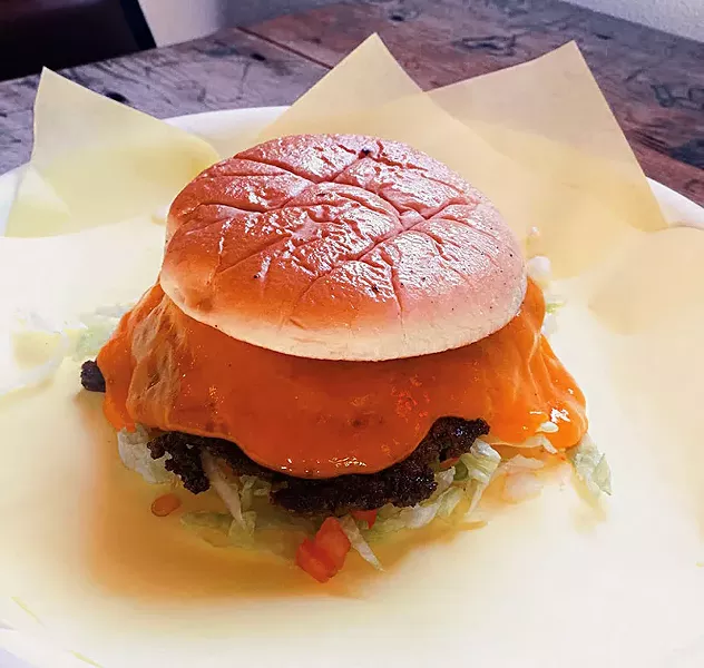 Feeling meat macho? Take it all out on a massive burger. - COURTESY