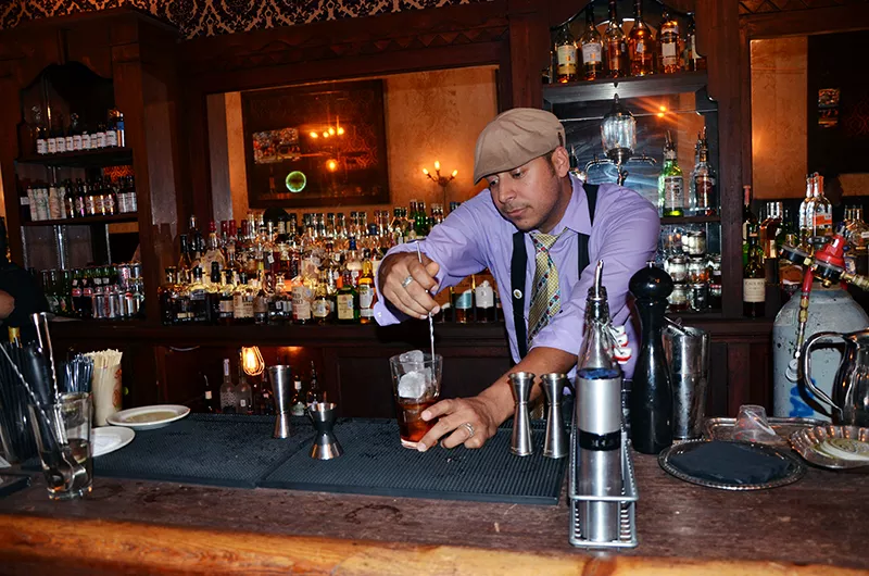 Jeret Peña at the helm of the Esquire Taven. His work there earned him a James Beard Foundation semifinalist nod back in 2012. - BRYAN RINDFUSS