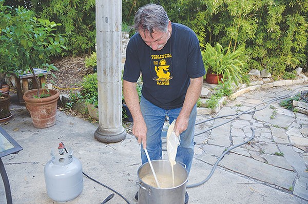 Jerry Lockey cooking a batch of beer - SCOTT ANDREWS