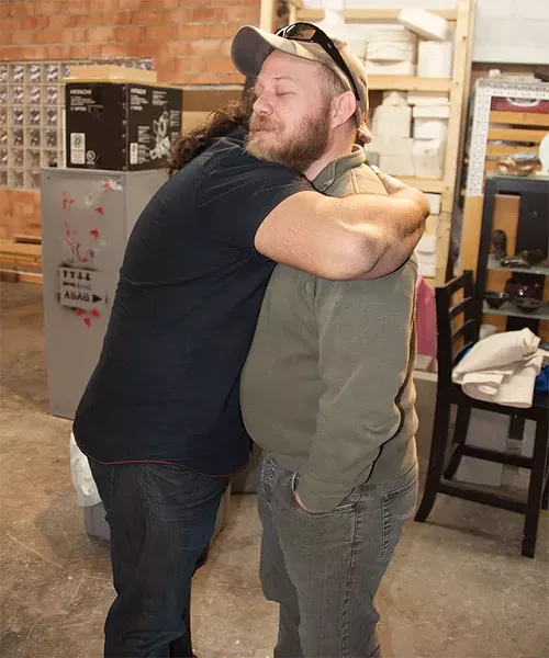 Joe Harjo and Chris Sauter hug it out - COURTESY PHOTO