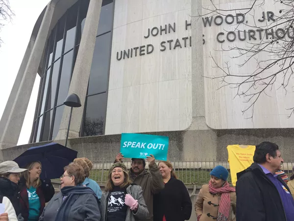 Members of the the Texas Organizing Project, Service Employees International Union of Texas, and Domesticas Unidas gathered at the John H. Wood Federal Courthouse Building on January 14, 2015, to oppose Governor-elect Greg Abbott lawsuit against President Barack Obama's executive action on immigration. - ALEXA GARCIA-DITTA