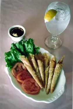 Thai Dee's delicate shrimp rolls - fried spring roll sheets housing chopped shrimp and celery - served with honey drenched sweet and sour sauce.