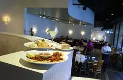 The new Paloma Blanca's open spaces and light interior accompany the familiar fare from the previous incarnation. From front: tacos al pastor, enchiladas ""divorciadas"" with ""irreconcilable"" rice and borracho beans, and tres leches cake.