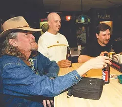Thomas Satchell, Joe Cordani, and Chris K. Gwin knock back some brews at Recovery Room.