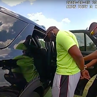 Black jogger wrestled into back of patrol car last year by San Antonio police has sued over the incident