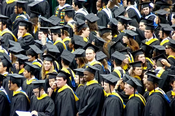 Look at all these poor saps getting ready to work their asses off to pay down their college debt. - WIKIPEDIA COMMONS