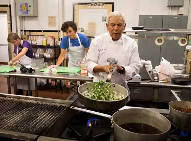 Adán Medrano cooks up some nopales in the kitchen. - VIA ADÁN MEDRANO