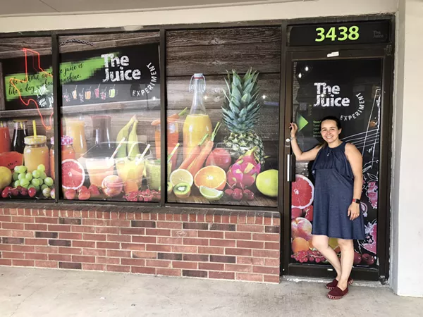 Aguirre in front of The Juice Experiment which opens this August. - JESS ELIZARRARAS