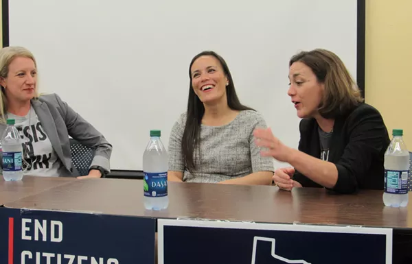 Lucinda Guinn (left) and Gina Ortiz Jones (center) listen to Tiffany Muller make a point during Friday's panel discussion. - SANFORD NOWLIN