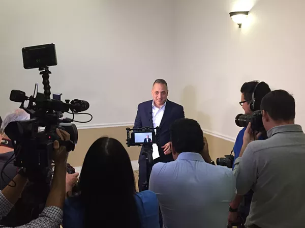 Councilman Greg Brockhouse addresses the media at the fire union's headquarters building prior to last year's charter amendment vote. - SANFORD NOWLIN