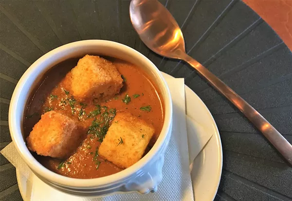Roasted tomato soup, served with house-made croutons, is among Spoon’s familiar but well-executed dishes. - RON BECHTOL