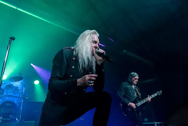 Saxon singer Biff Byford leans on the monitor while guitarist Paul Quinn unleashes a monster riff. - JAIME MONZON