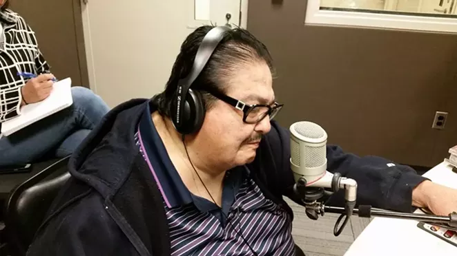 The late Jimmy Gonzalez takes the mic during an appearance on KXTN radio. - VIA GRUPO MAZZ'S FACEBOOK PAGE