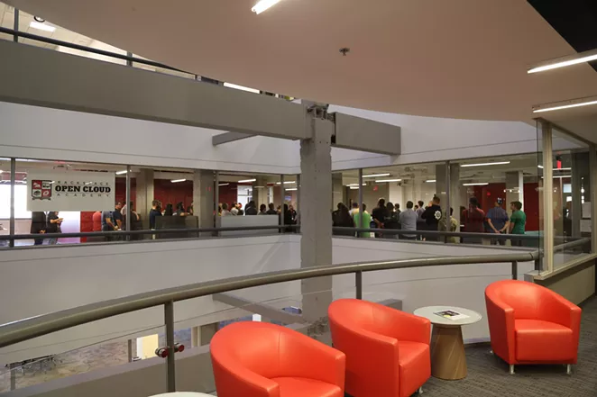 Employees meet inside Rackspace's corporate headquarters. - COURTESY